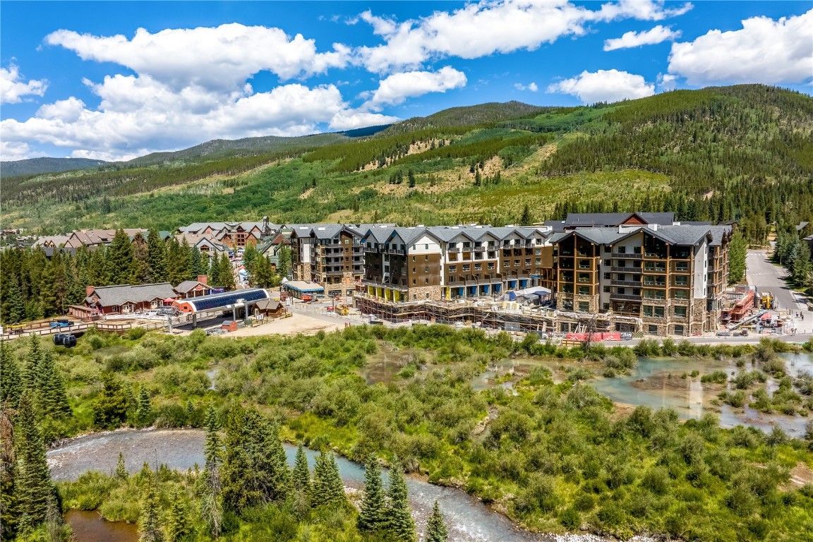 75 Hunki Dori Court, Unit W113 Keystone, CO 80435 - Photo 38 of 50 a view of a lake with a building in the background
