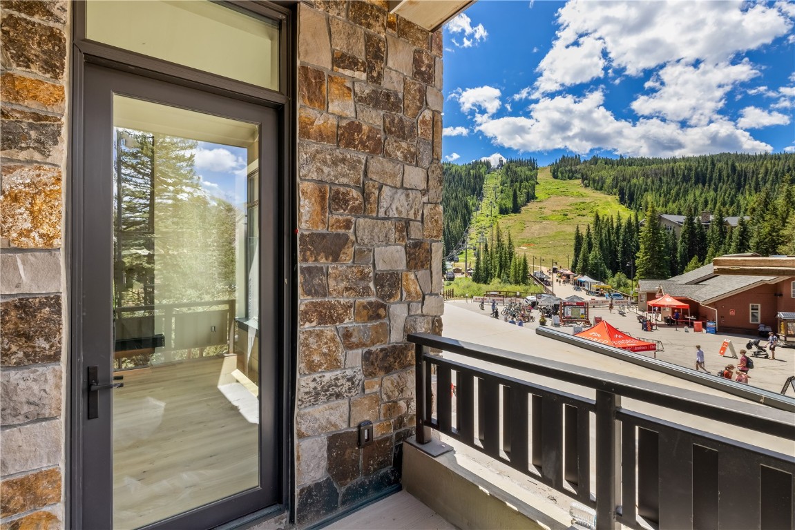 75 Hunki Dori Court, Unit W113 Keystone, CO 80435 - Photo 4 of 50 a view of balcony with two chairs and potted plants