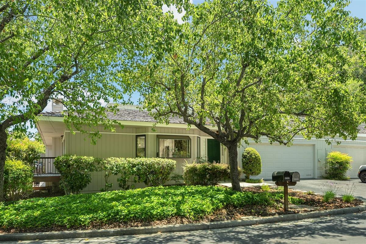 23030 Stonebridge Cupertino, CA 95014 - Photo 1 of 26 front view of a house with a tree