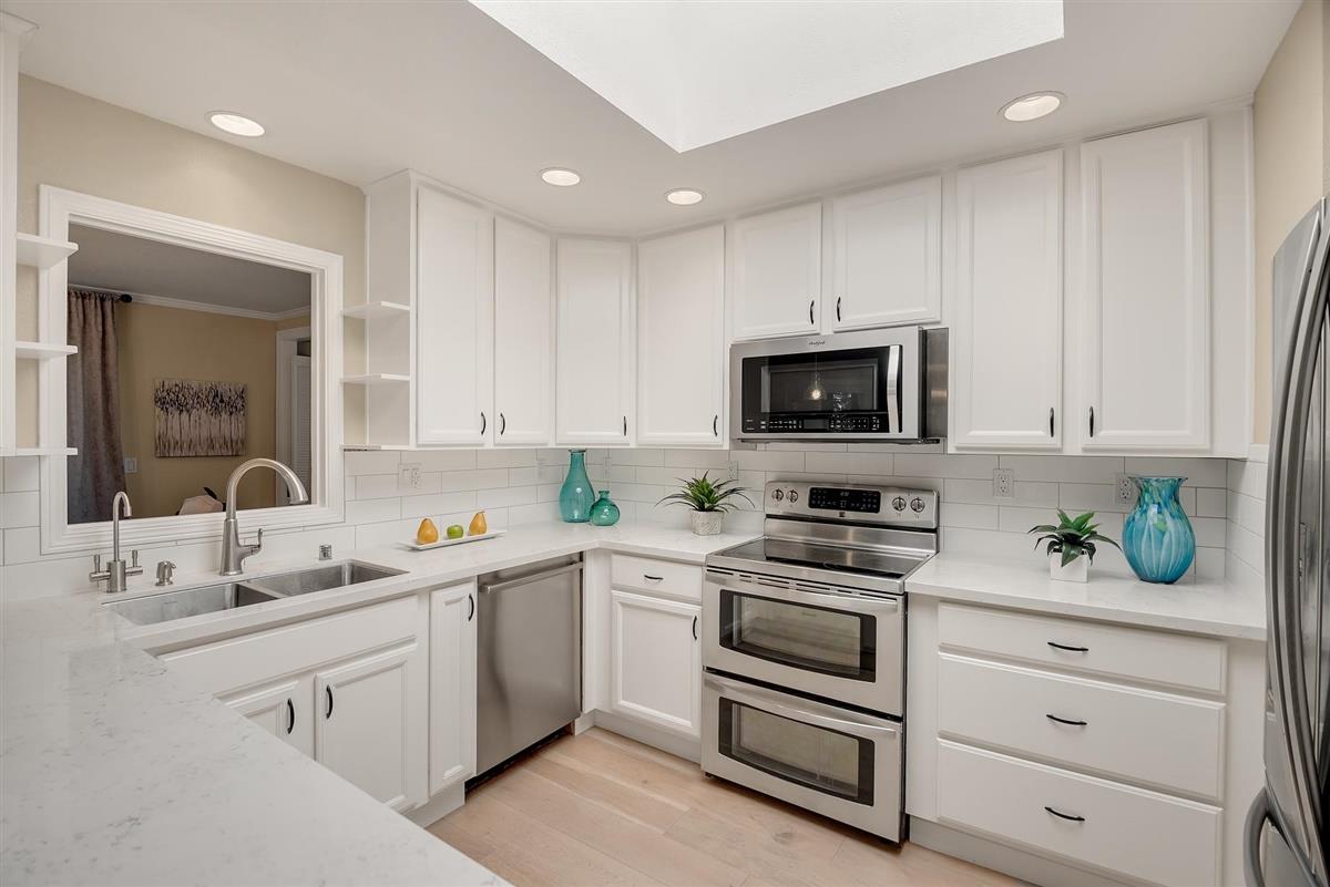 23030 Stonebridge Cupertino, CA 95014 - Photo 13 of 26 a kitchen with a sink stove and microwave