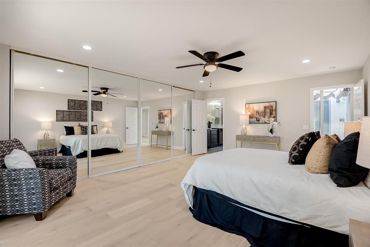 23030 Stonebridge Cupertino, CA 95014 - Photo 16 of 26 a large bedroom with a bed couch and a view of living room