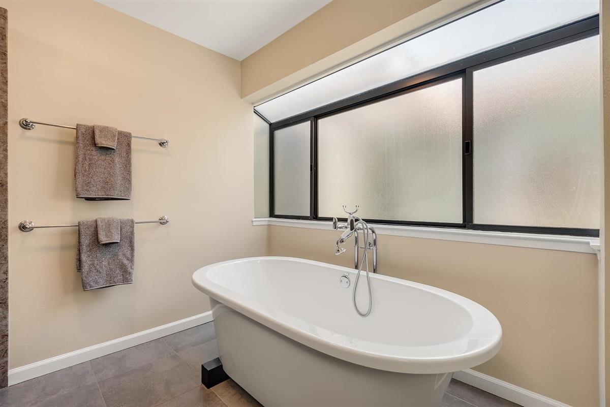 23030 Stonebridge Cupertino, CA 95014 - Photo 18 of 26 a bathroom with a sink and a large mirror