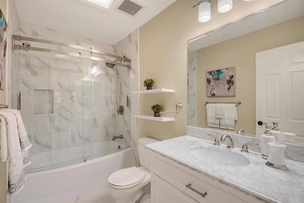 23030 Stonebridge Cupertino, CA 95014 - Photo 22 of 26 a bathroom with a granite countertop sink mirror toilet and bathtub