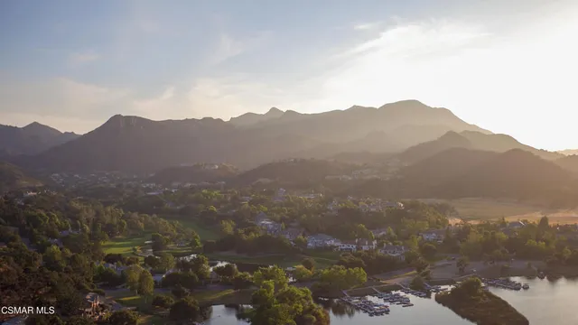 a view of a town with mountains in the background