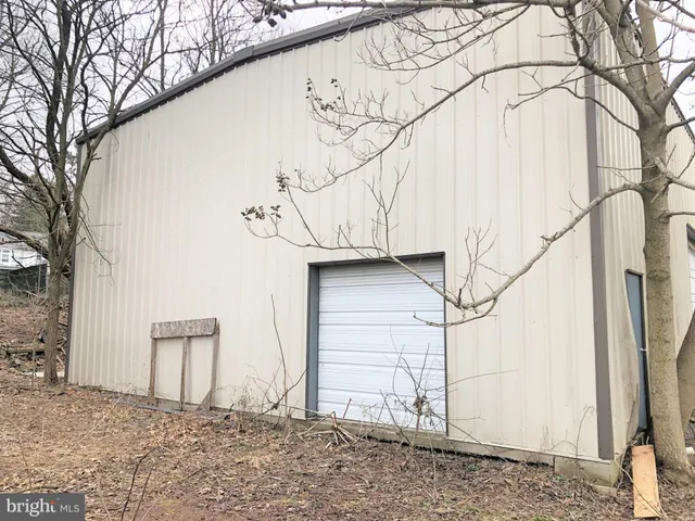 a view of a house with a snow in the background