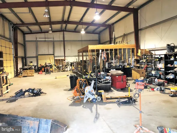 a wooden bench sitting in front of a building