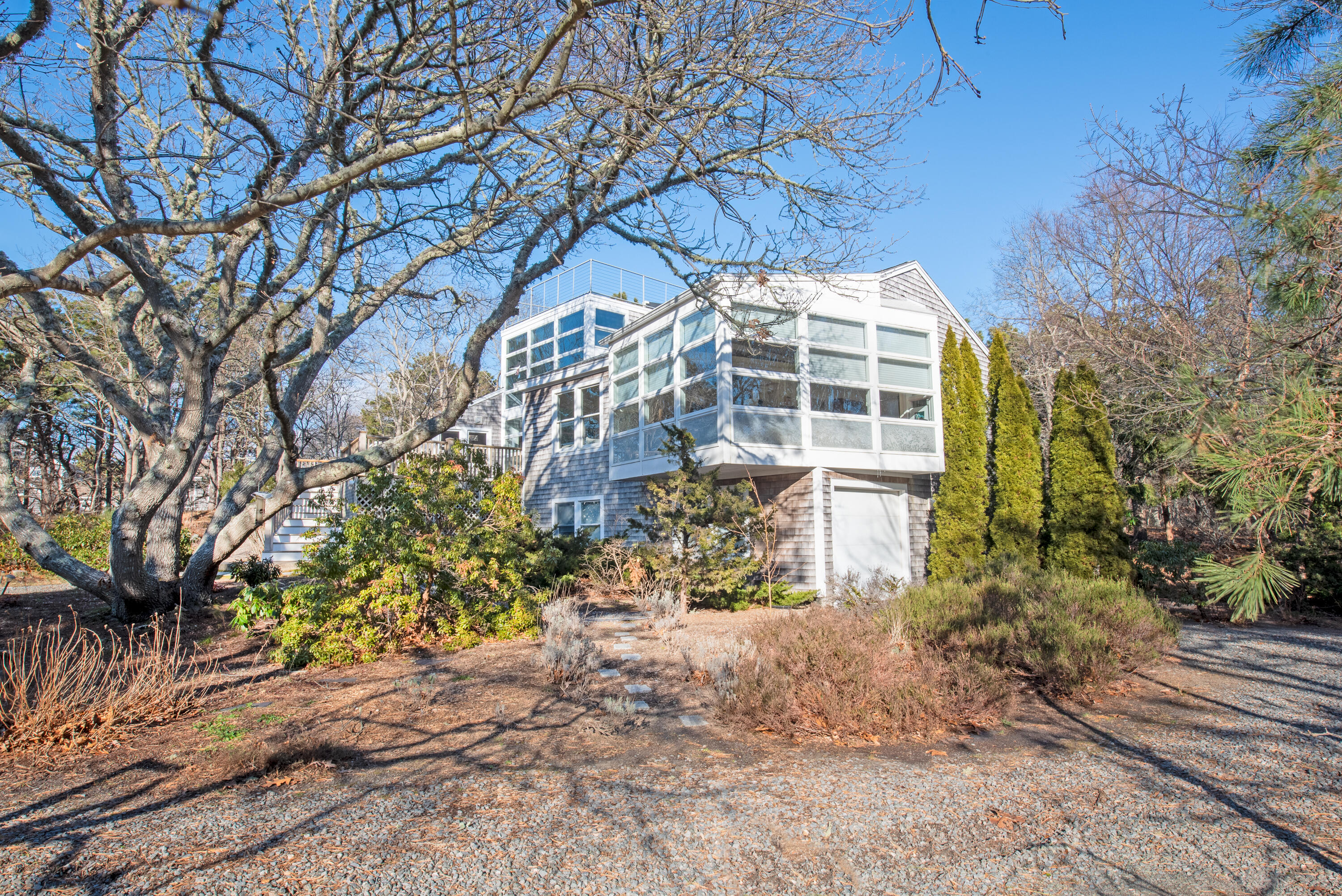 80 Shurtleff Road Eastham, MA 02642 - Photo 2 of 34 a front view of a house with a yard