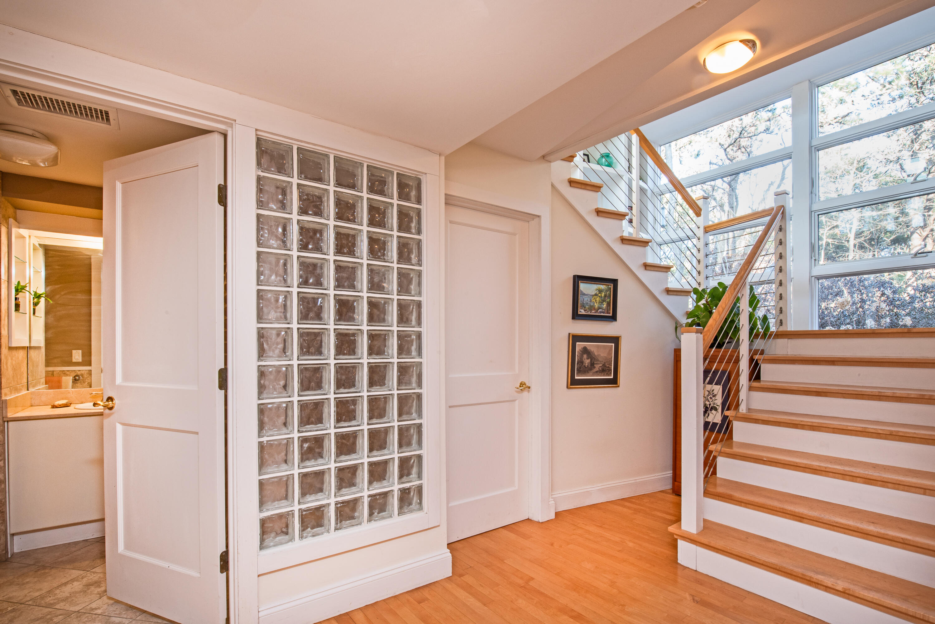 80 Shurtleff Road Eastham, MA 02642 - Photo 23 of 34 a view of a livingroom with wooden floor and stairs