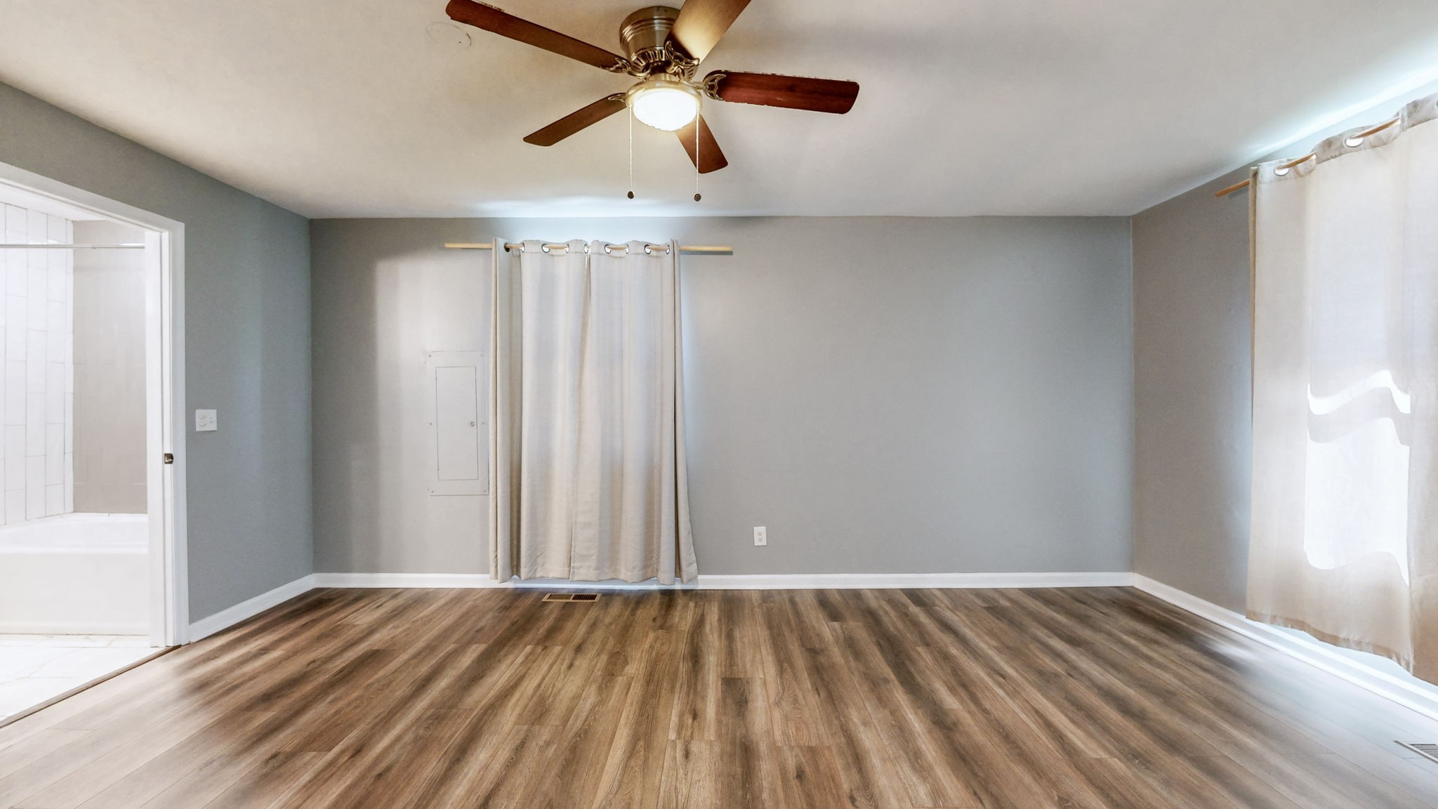 1214 Rutherford Street Murfreesboro, TN 37130 - Photo 14 of 37 wooden floor in an empty room with a window