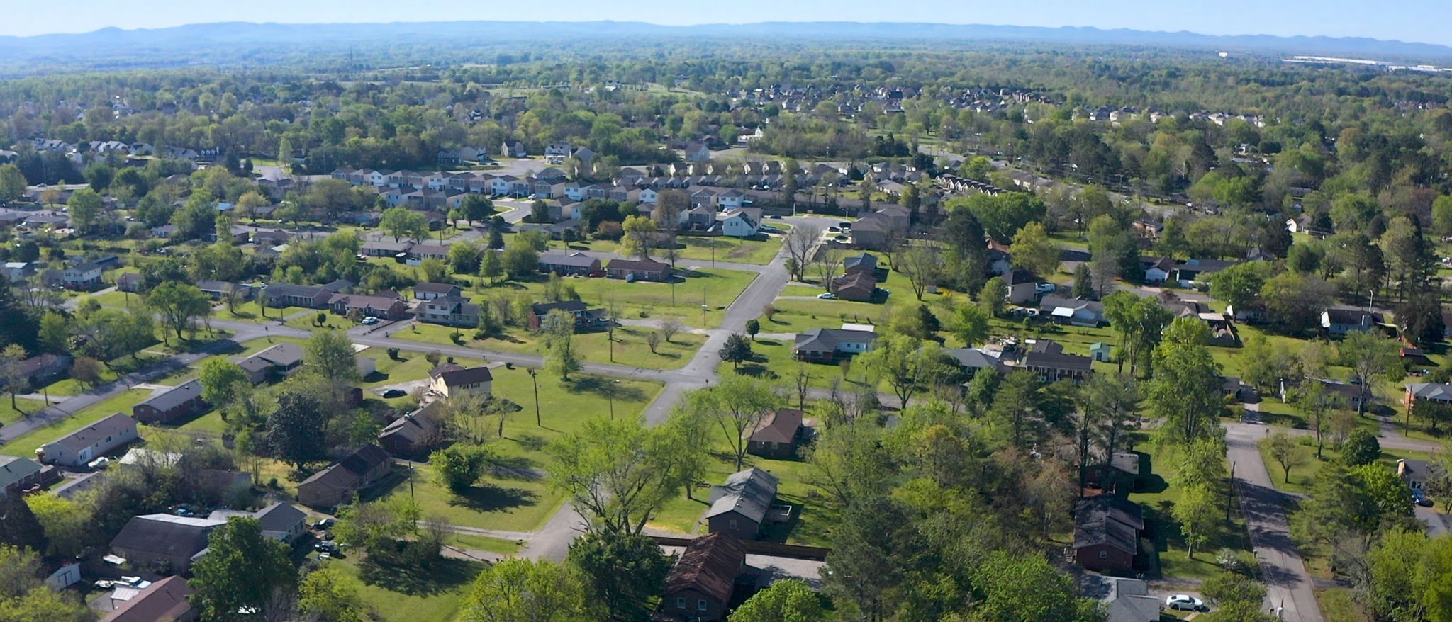 1214 Rutherford Street Murfreesboro, TN 37130 - Photo 36 of 37 an aerial view of a houses with a lush green hillside