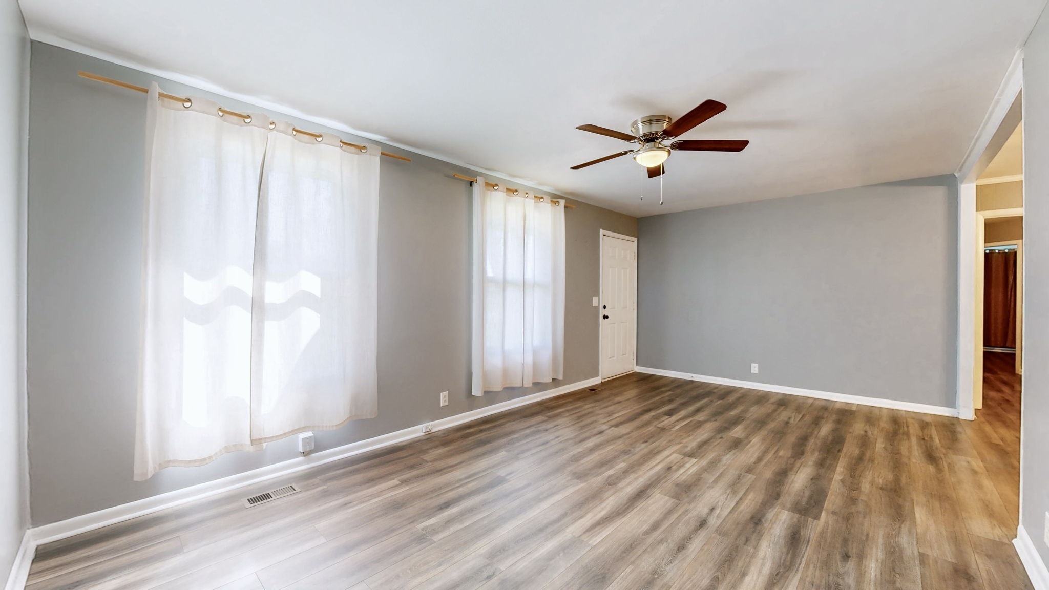 1214 Rutherford Street Murfreesboro, TN 37130 - Photo 7 of 37 wooden floor in an empty room with a window