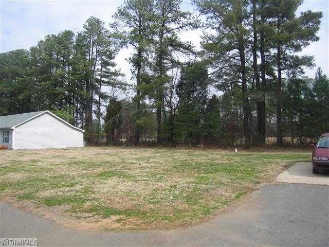 Exterior Front. Paved drive with ample parking.