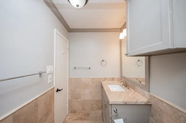 a bathroom with a sink and a mirror