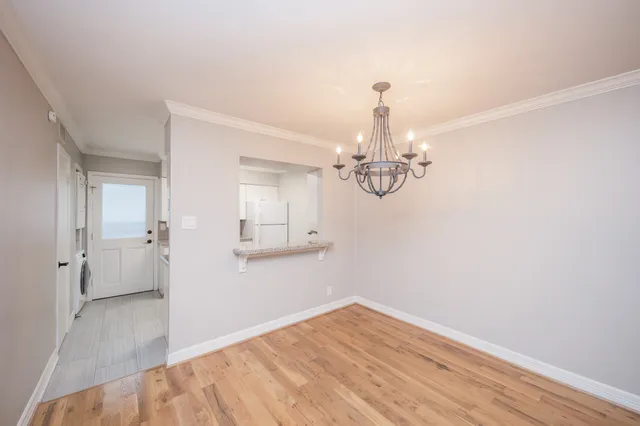 a view of a chandelier in an empty room