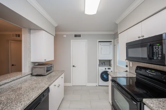 a kitchen with a stove and a microwave