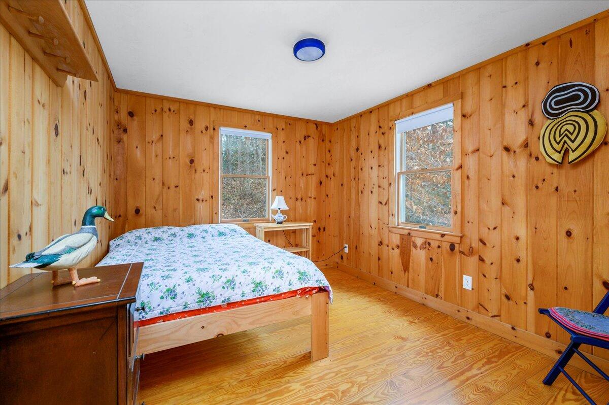 58 Oyster Pond Road Falmouth, MA 02540 - Photo 13 of 30 a bedroom with a bed and a window