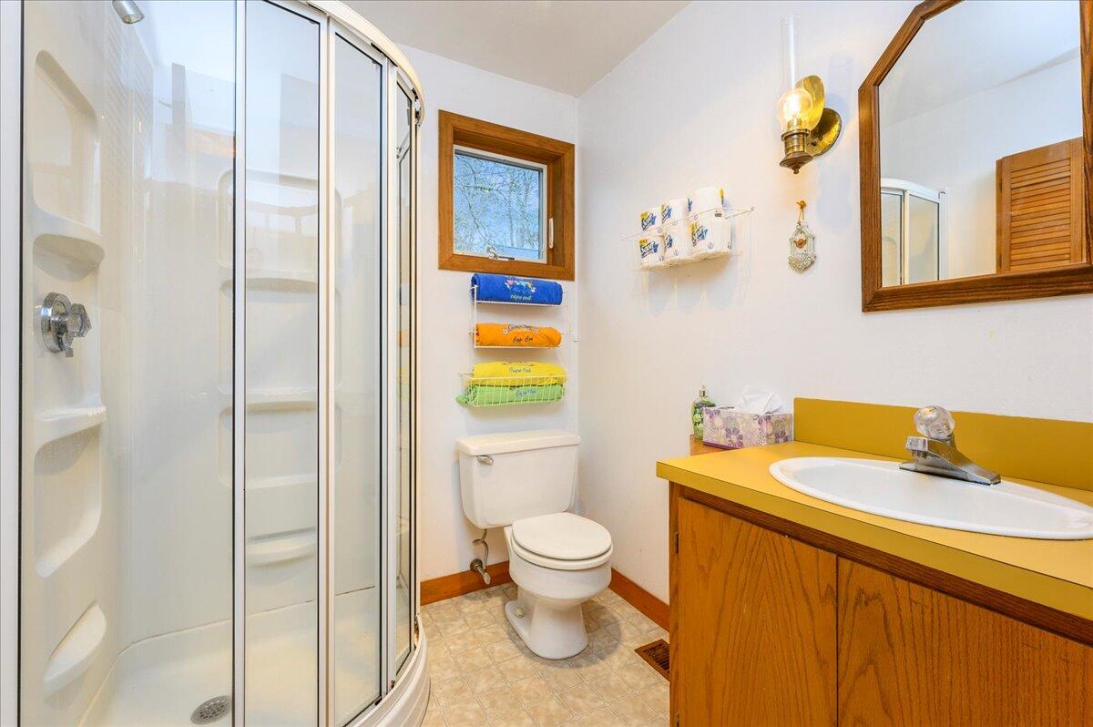 58 Oyster Pond Road Falmouth, MA 02540 - Photo 7 of 30 a bathroom with a sink toilet and shower