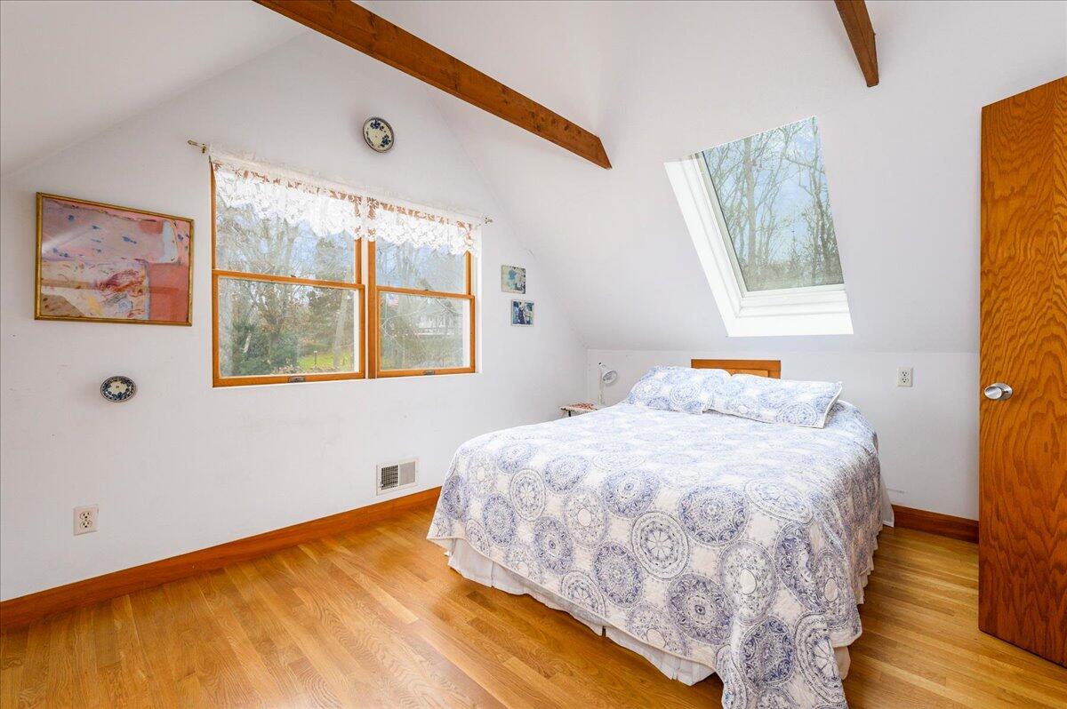 58 Oyster Pond Road Falmouth, MA 02540 - Photo 9 of 30 a bed sitting in a bedroom next to a window