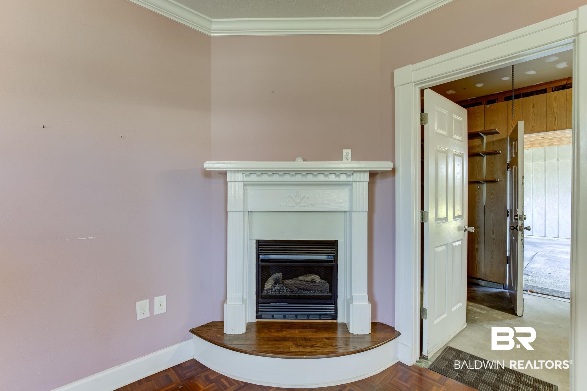 606 East Myrtle Avenue Foley, AL 36535 - Photo 7 of 24 Interior details featuring parquet floors, crown molding, and wooden walls