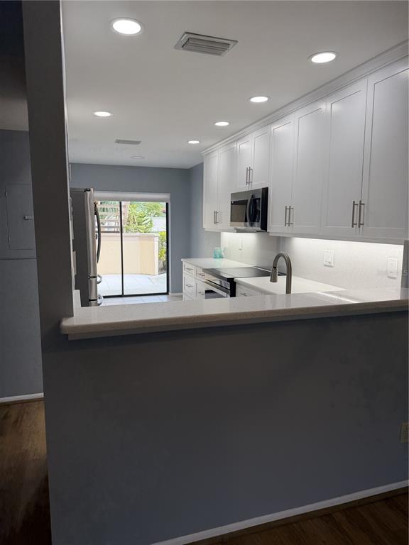 2004 Longpointe Circle Venice, FL 34293 - Photo 25 of 54 a kitchen with a sink stainless steel appliances and cabinets