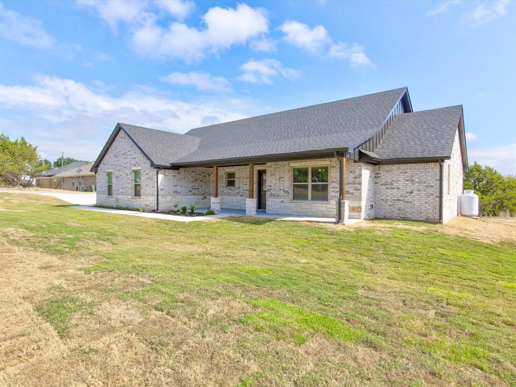 a house view with swimming pool in front of it