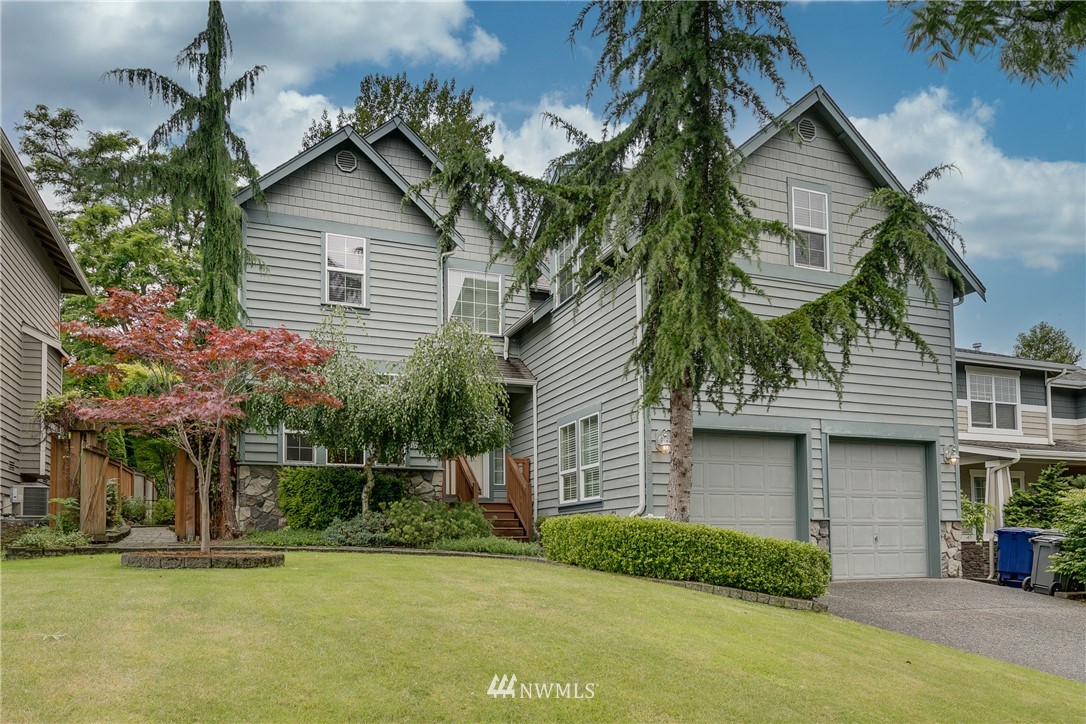 23034 12th Drive Southeast Bothell, WA 98021 - Photo 1 of 32 a front view of a house with a yard