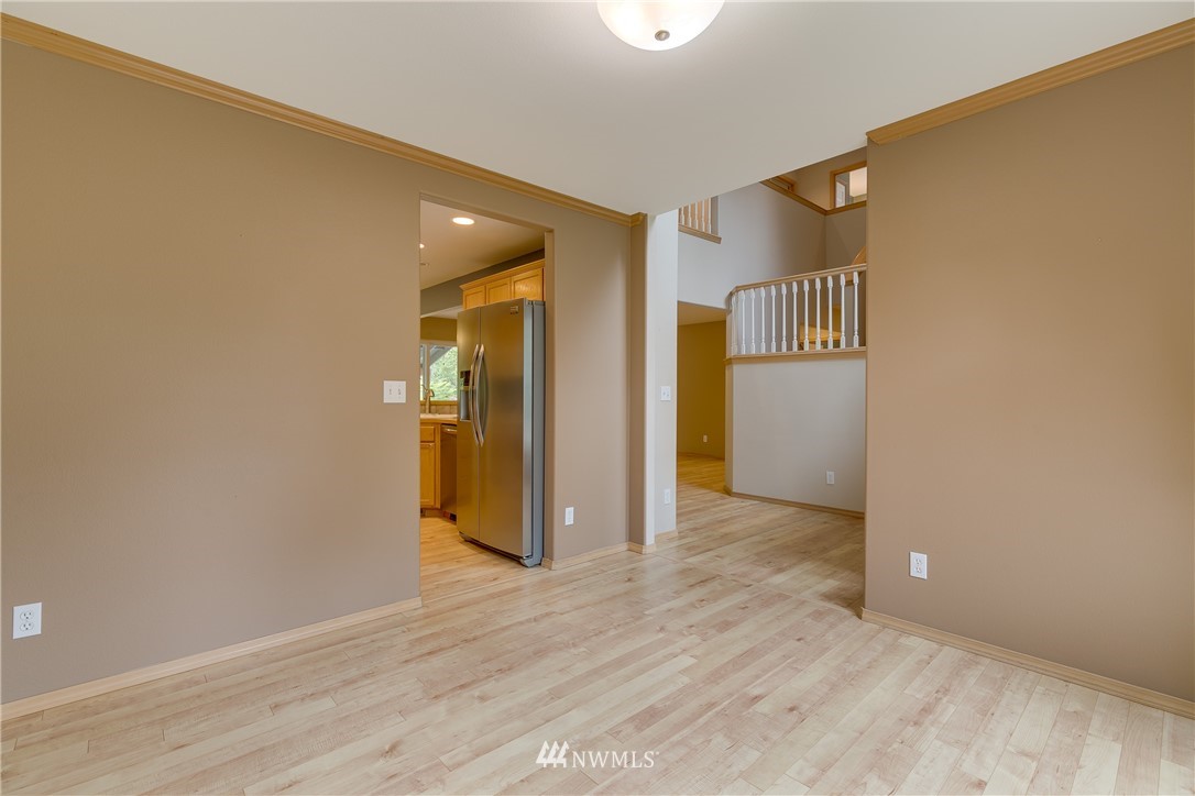 23034 12th Drive Southeast Bothell, WA 98021 - Photo 13 of 32 a view of an empty room with wooden floor and closet