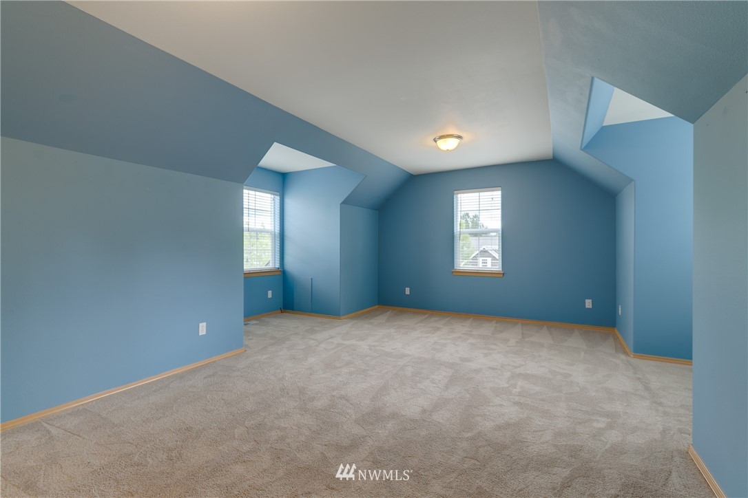 23034 12th Drive Southeast Bothell, WA 98021 - Photo 17 of 32 an empty room with windows and closet in a room