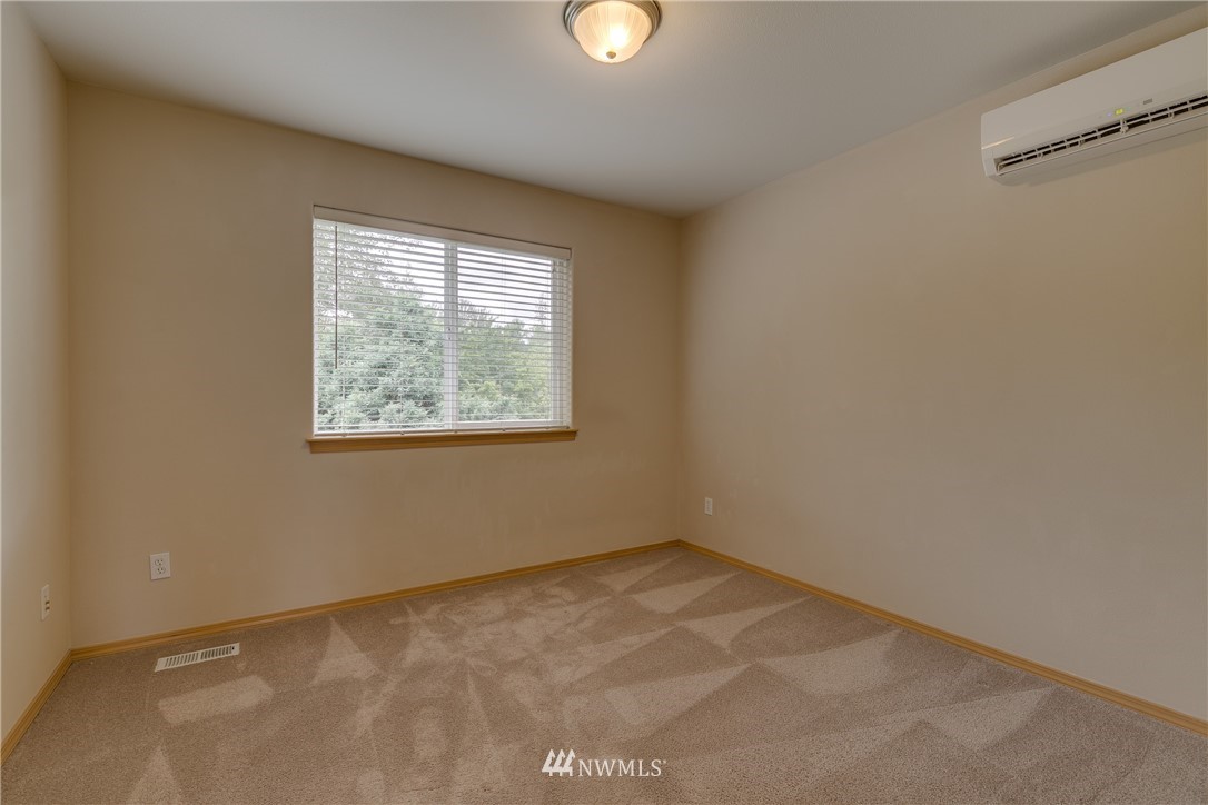 23034 12th Drive Southeast Bothell, WA 98021 - Photo 19 of 32 an empty room with windows