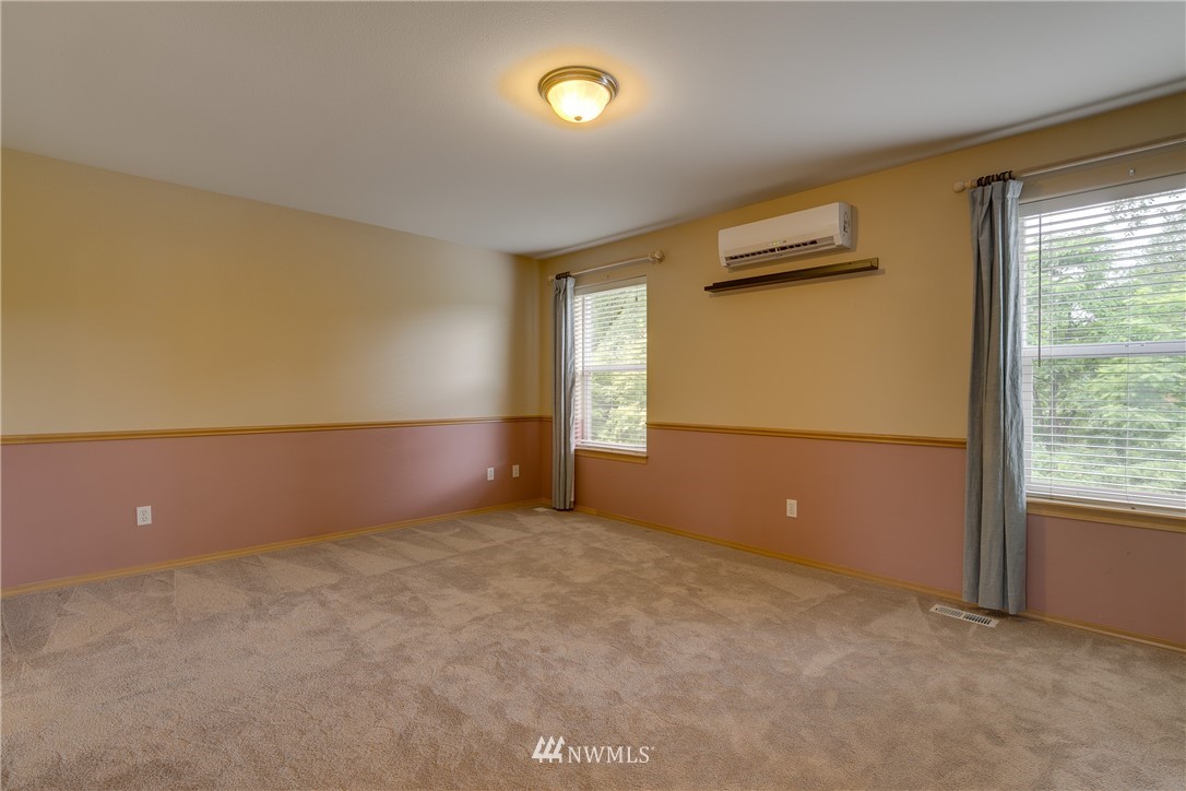 23034 12th Drive Southeast Bothell, WA 98021 - Photo 21 of 32 an empty room with windows and closet