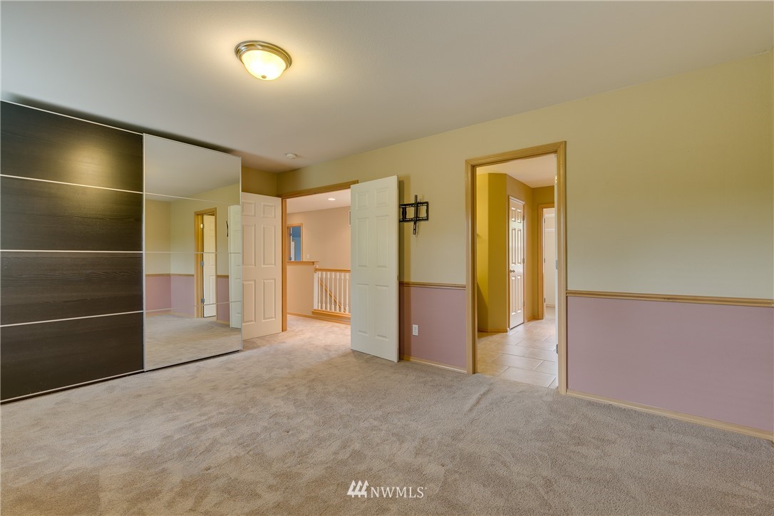 23034 12th Drive Southeast Bothell, WA 98021 - Photo 23 of 32 a view of empty room with wooden floor