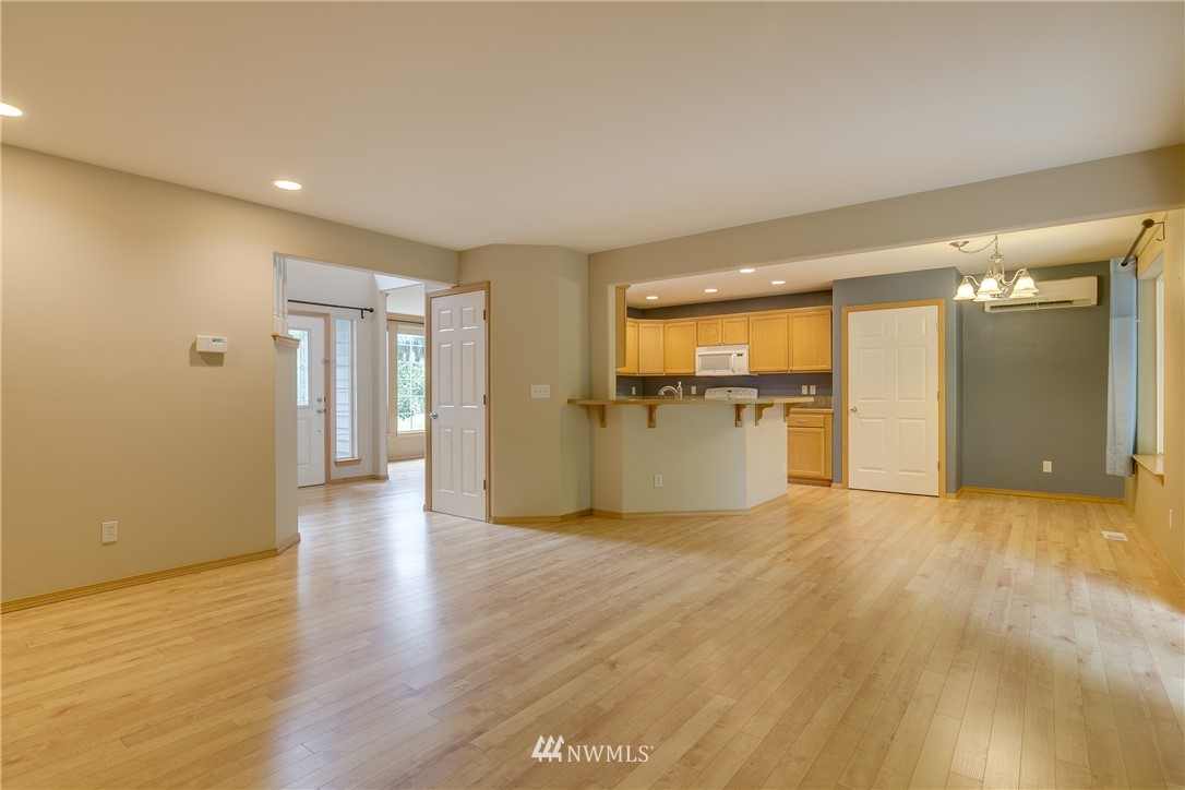 23034 12th Drive Southeast Bothell, WA 98021 - Photo 5 of 32 a view of a kitchen with a sink and a refrigerator