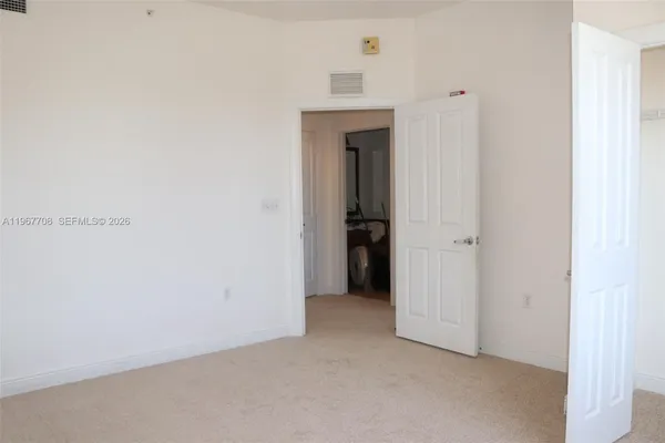 a view of a livingroom and a hallway