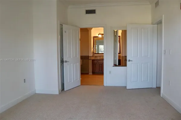 a bathroom with a sink a mirror and a shower