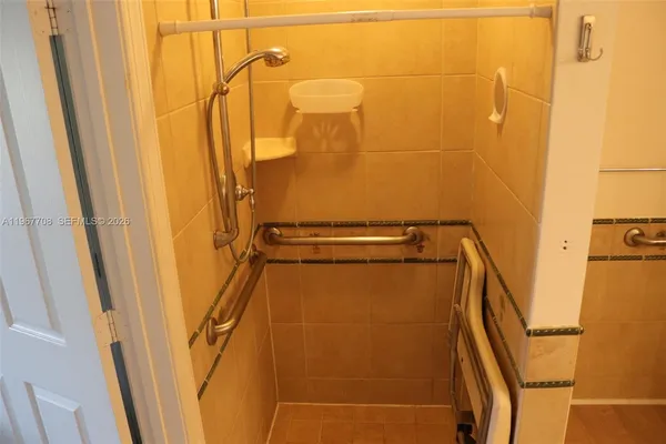 a bathroom with a shower and a toilet