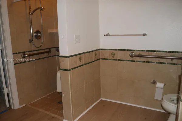 a view of a door and window in an empty room