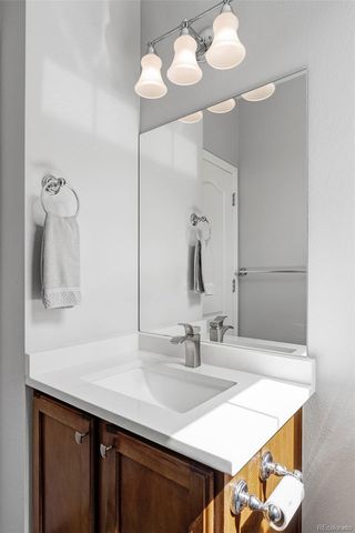 a bathroom with a sink vanity and a mirror