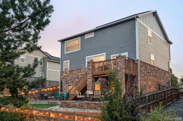 a view of a swimming pool with a table and chairs