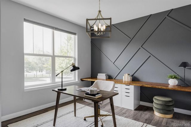 a work room with furniture and a window