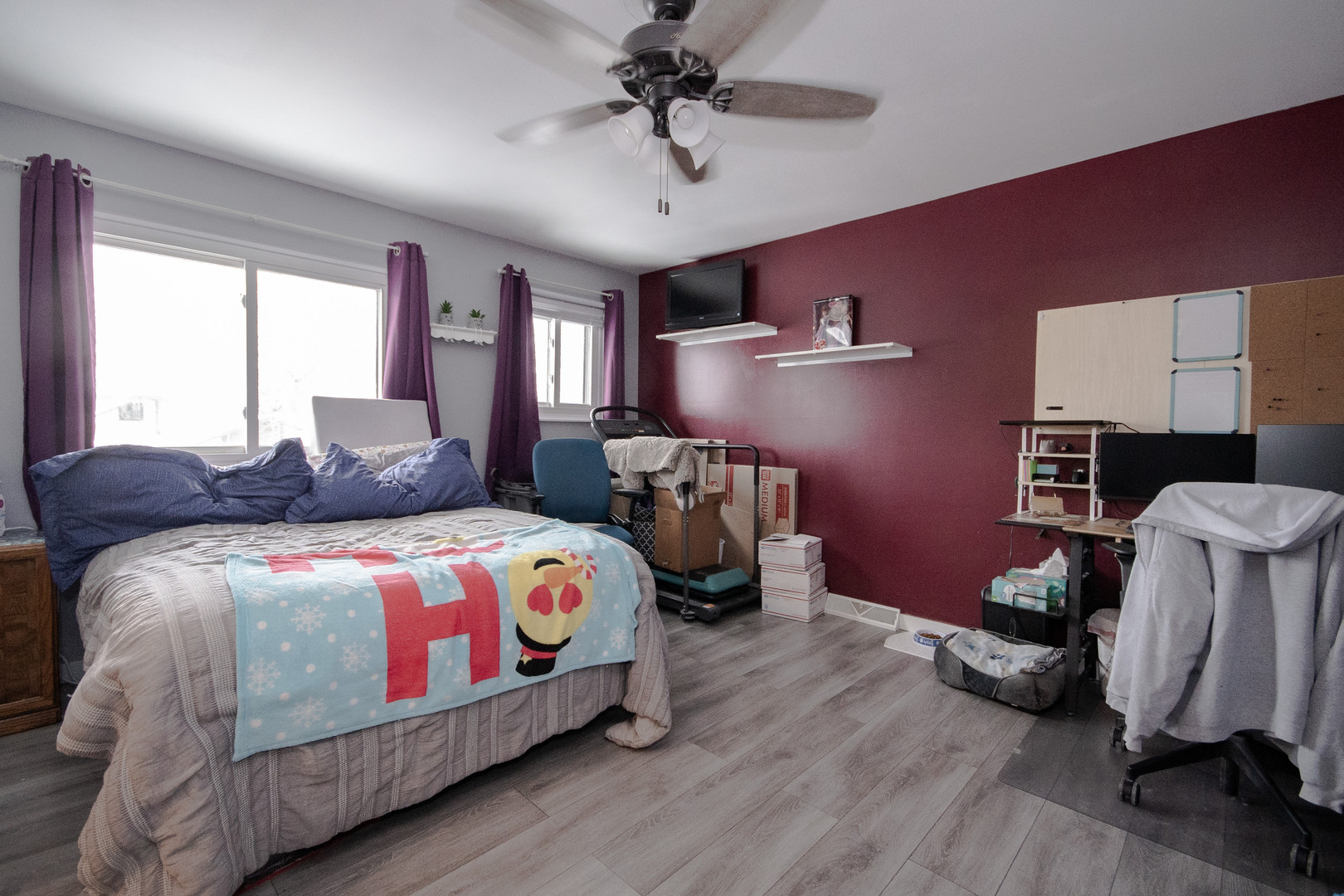 746 East Devon Avenue Roselle, IL 60172 - Photo 13 of 24 a bedroom with a bed and wooden floor