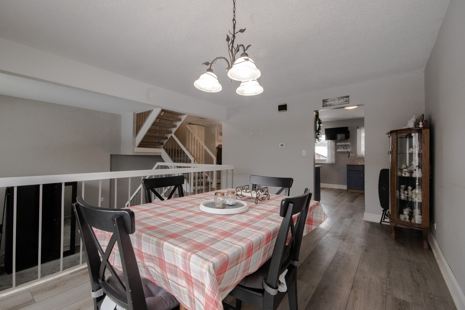 746 East Devon Avenue Roselle, IL 60172 - Photo 7 of 24 a view of a dining room with furniture and wooden floor