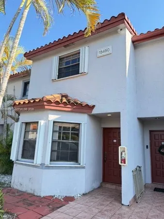 a front view of a house with yard