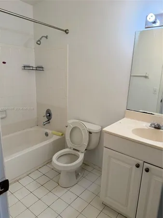 a bathroom with a sink a toilet and a bathtub