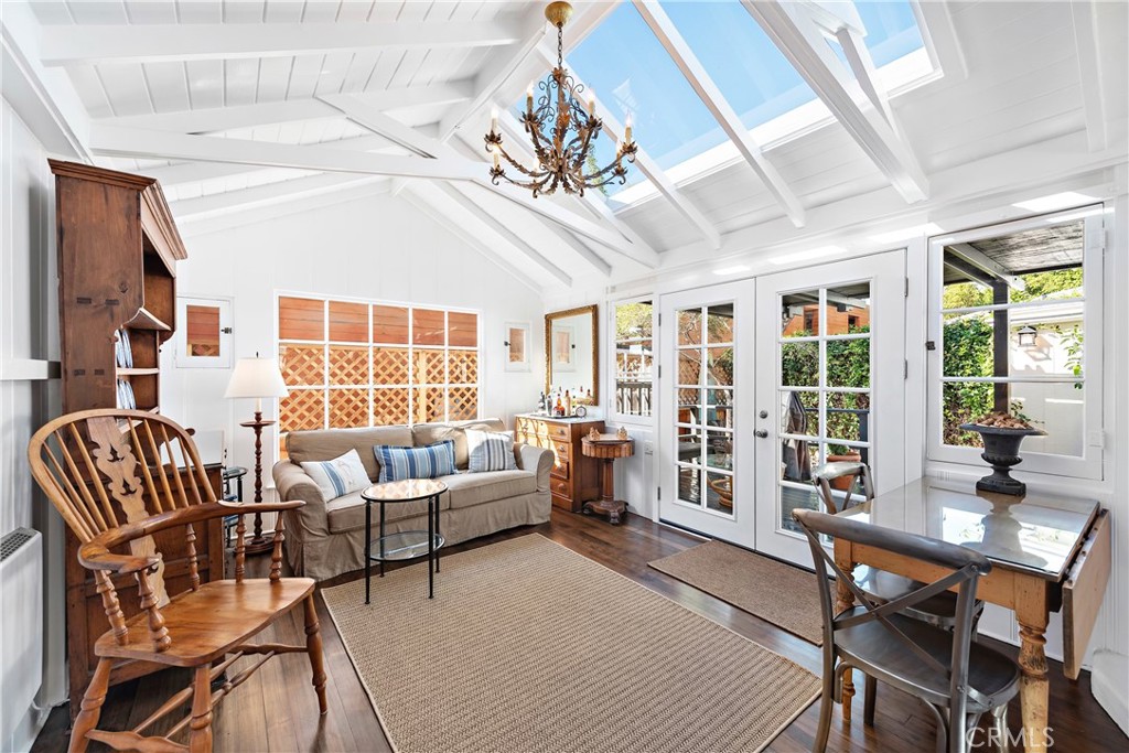31521 Summit Road Laguna Beach, CA 92651 - Photo 9 of 21 Living room with newer retractable skylights. French doors open onto the covered deck.
