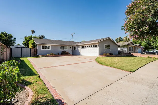 a view of house with outdoor space and seating area