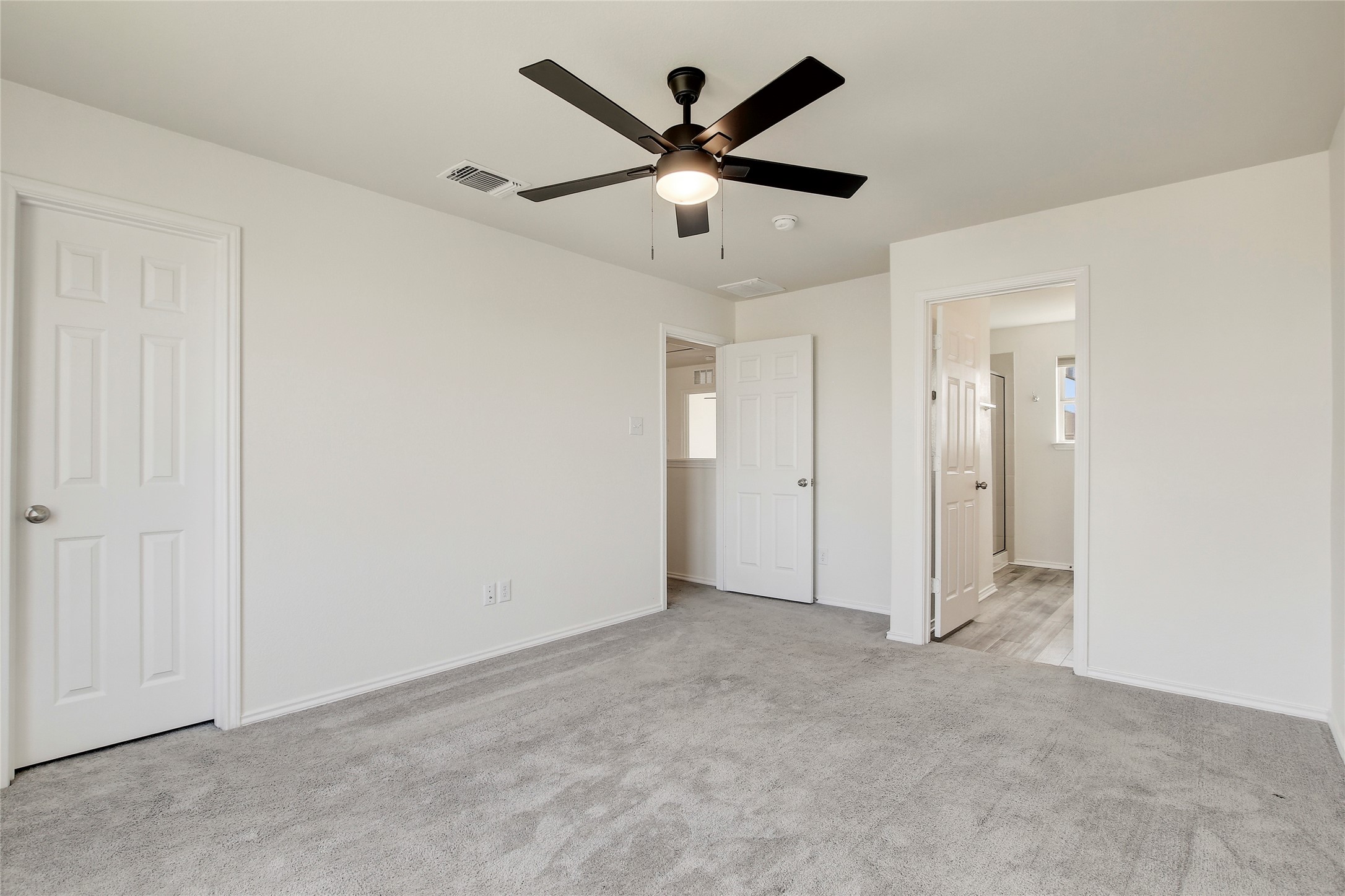 449 Stone Water Lane Jarrell, TX 76537 - Photo 10 of 18 Neutral tone walls featuring plush grey carpet