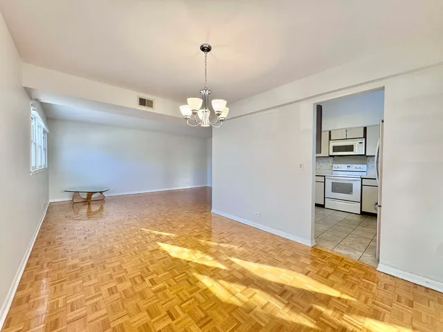 a kitchen with stainless steel appliances granite countertop a refrigerator sink and cabinets