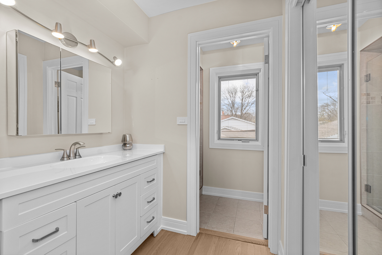 20 Colony Lane Deerfield, IL 60015 - Photo 21 of 33 a bathroom with a double vanity sink and mirror