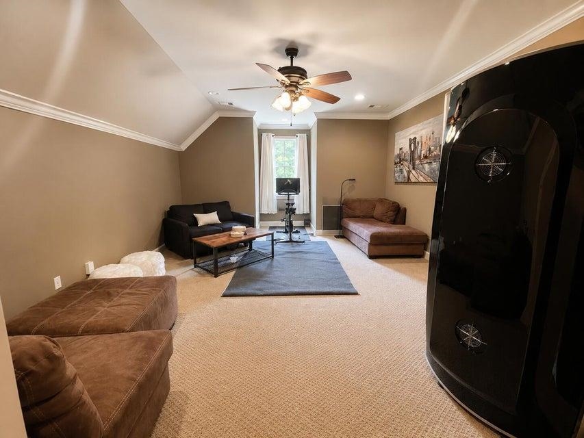 295 North Ridge Drive Saltillo, MS 38866 - Photo 32 of 38 a living room with furniture and a chandelier