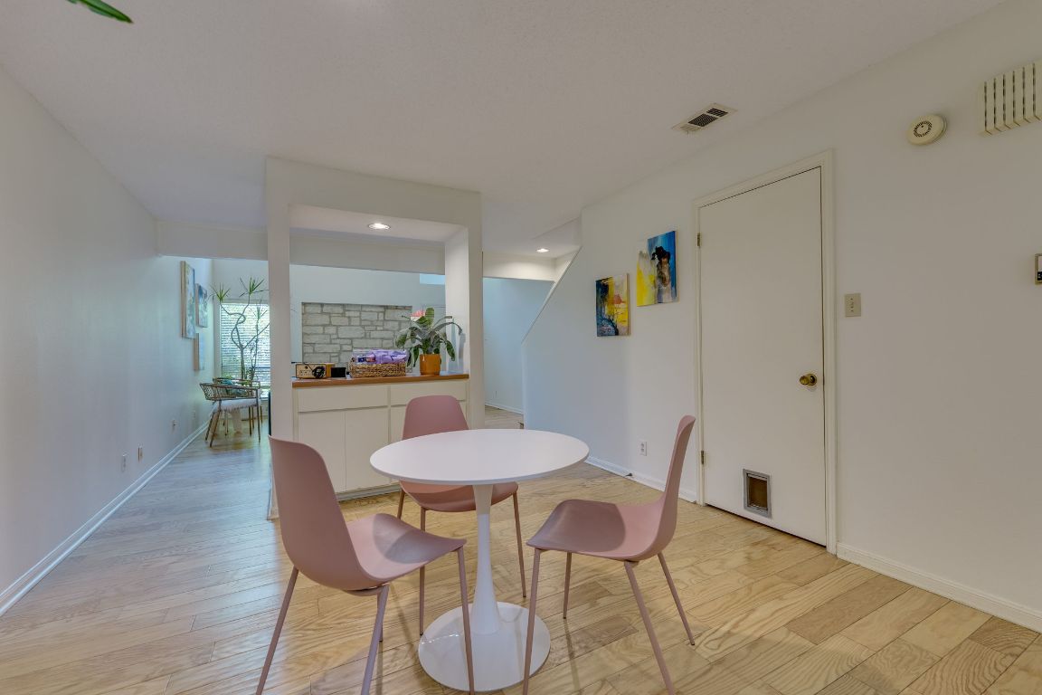 9226 Jollyville Road, Unit 132 Austin, TX 78759 - Photo 11 of 25 Dining space featuring light wood-style floors and recessed lighting